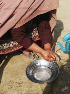Woman washing hands, Pakistan