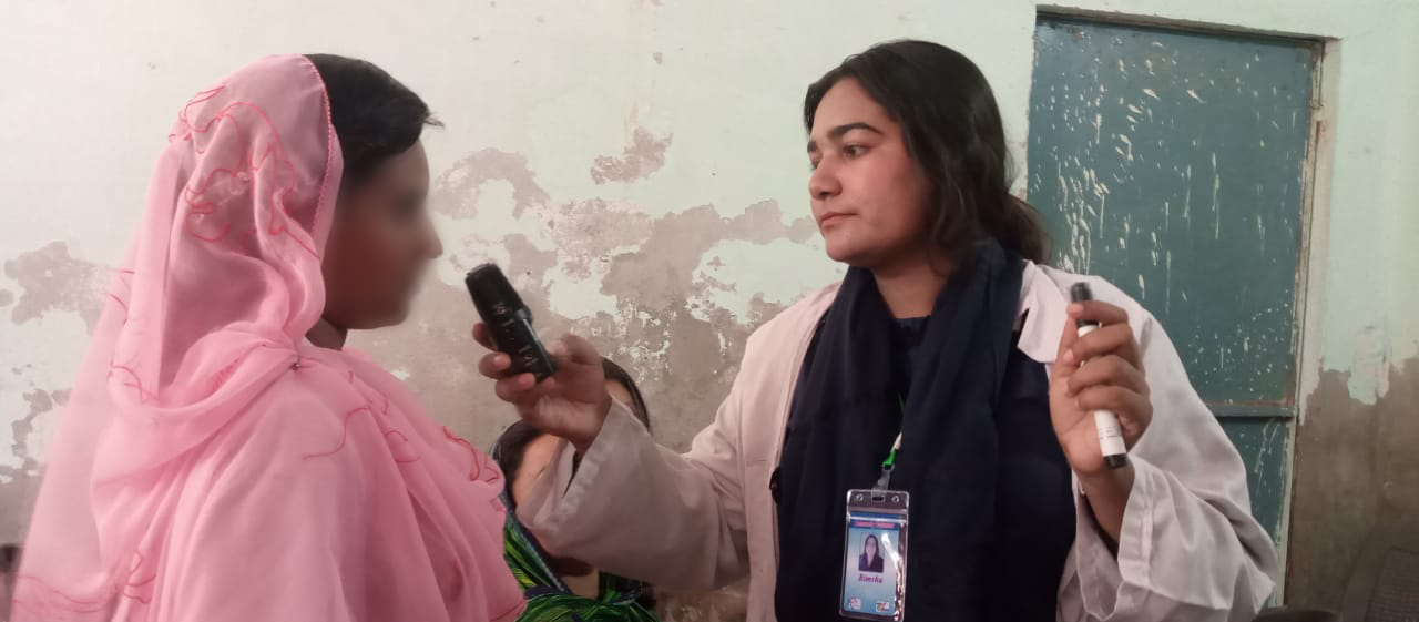 woman health worker interviewing another woman